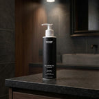 Black bottle of SHARP oil control gel cleanser on a bathroom counter